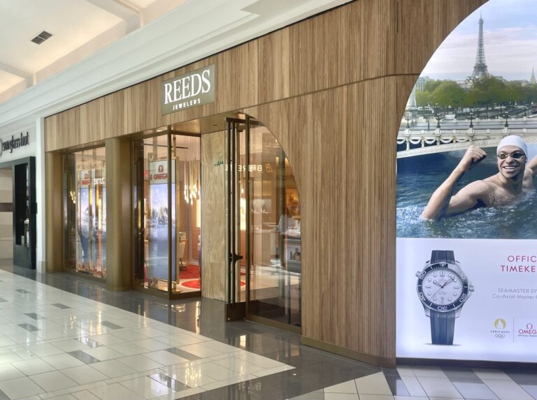 Reeds Jewelers commercial glass and metal storefront installation with wood façade in shopping mall